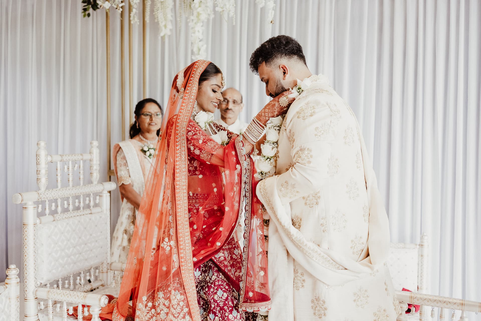Indian wedding couple exchanging garlands